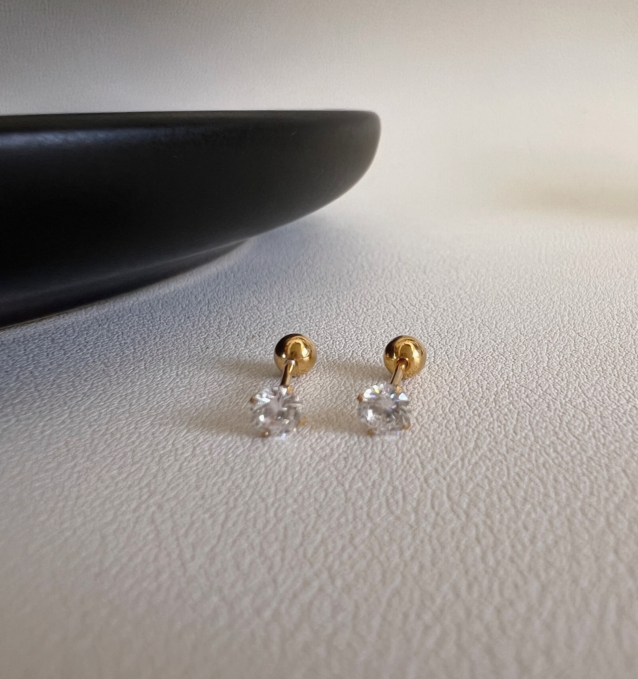Tiny shiny stud