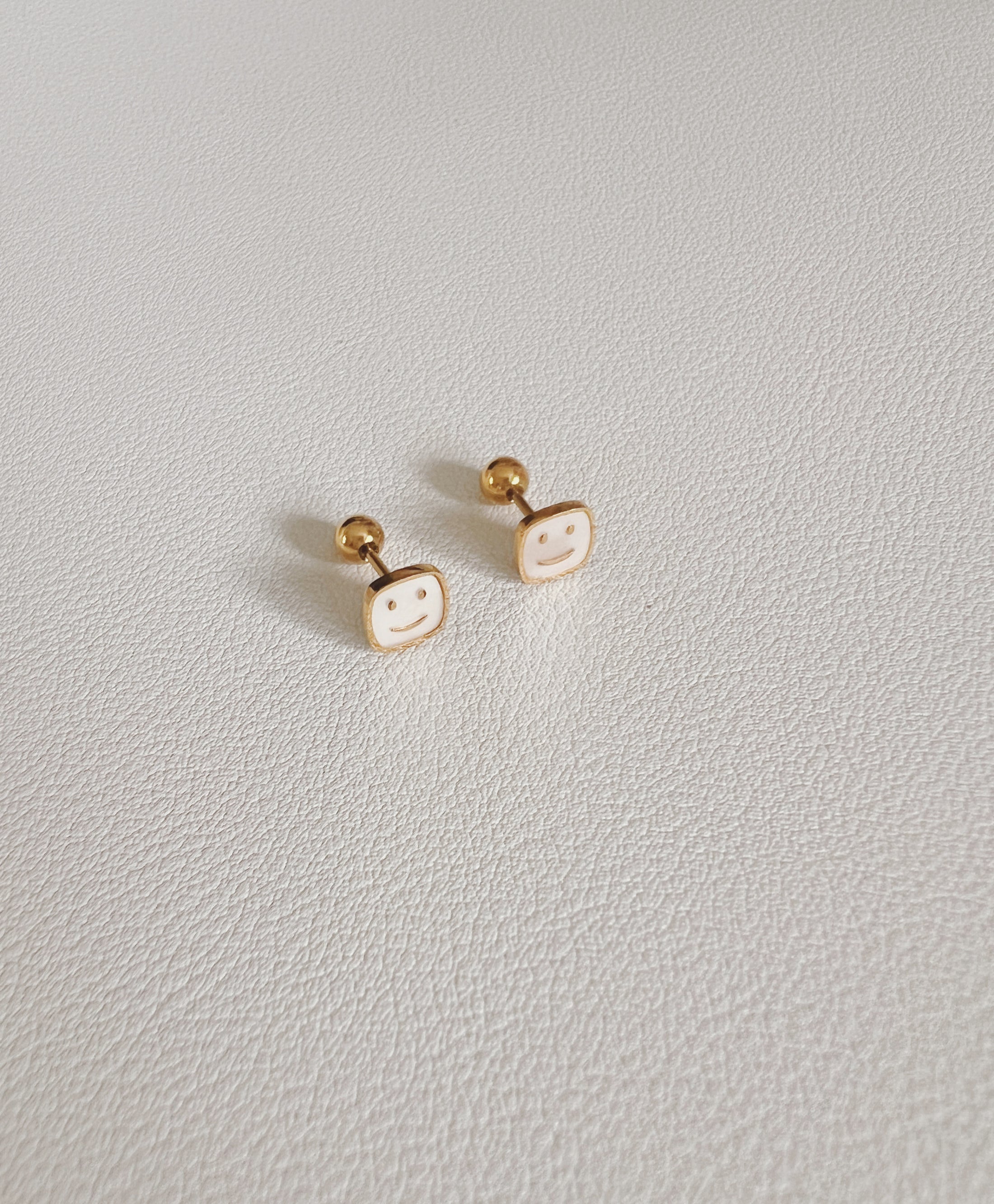 Happy  face  studs 2
