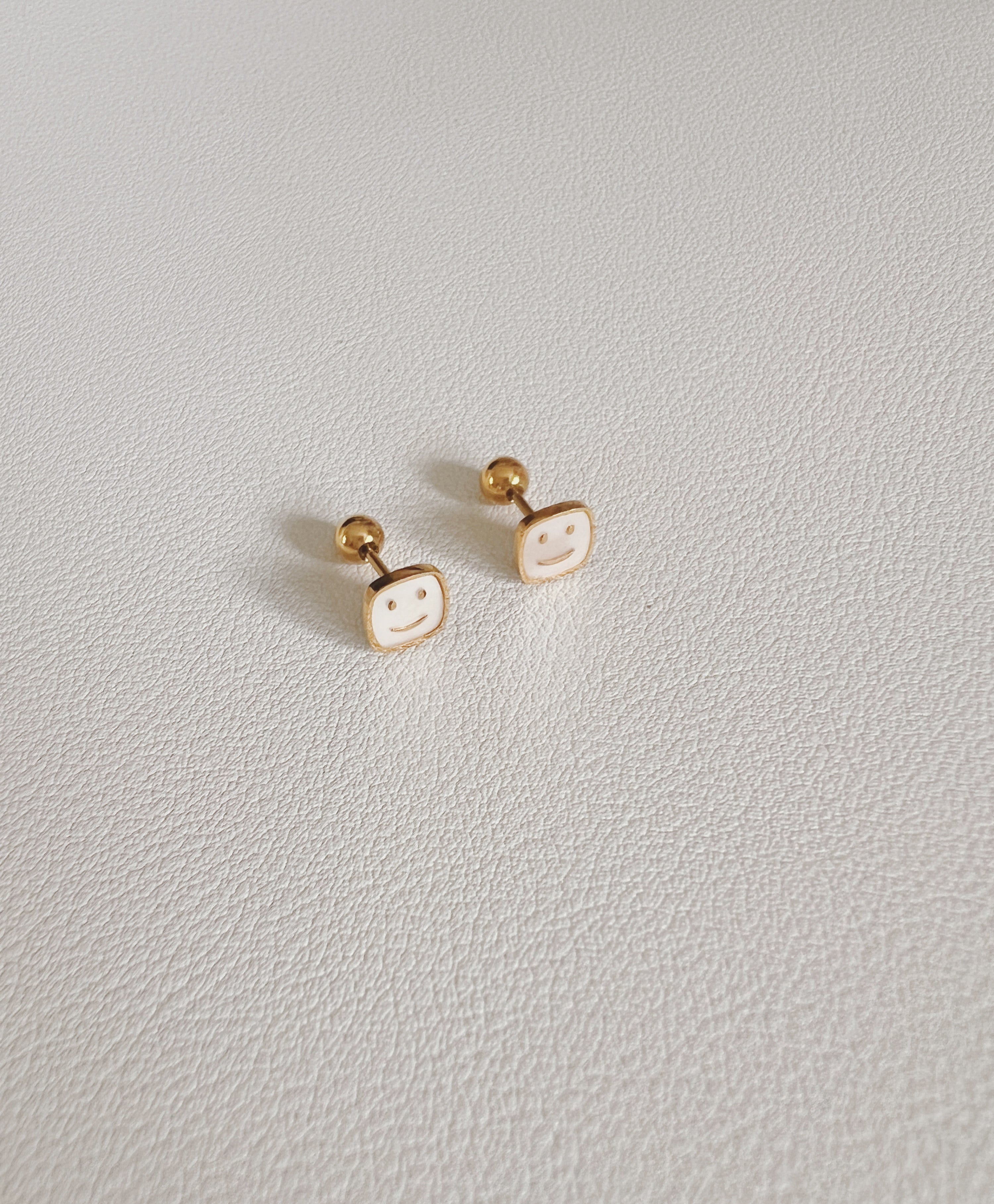 Happy  face  studs 2